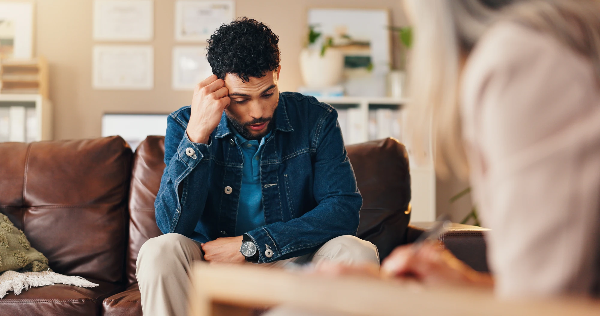 Adult talking with a clinician in a private office