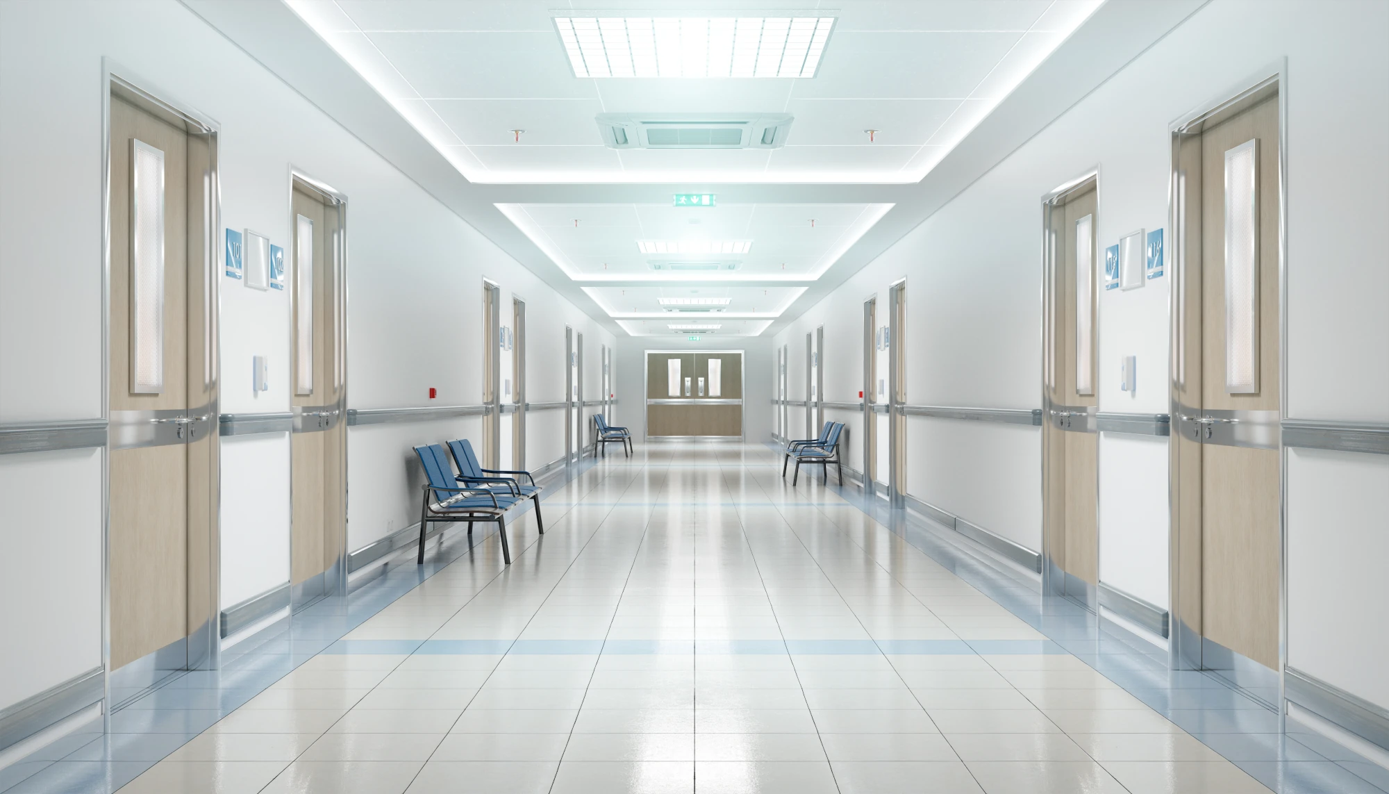 A quiet, empty hospital hallway with soft lighting and closed doors along both sides