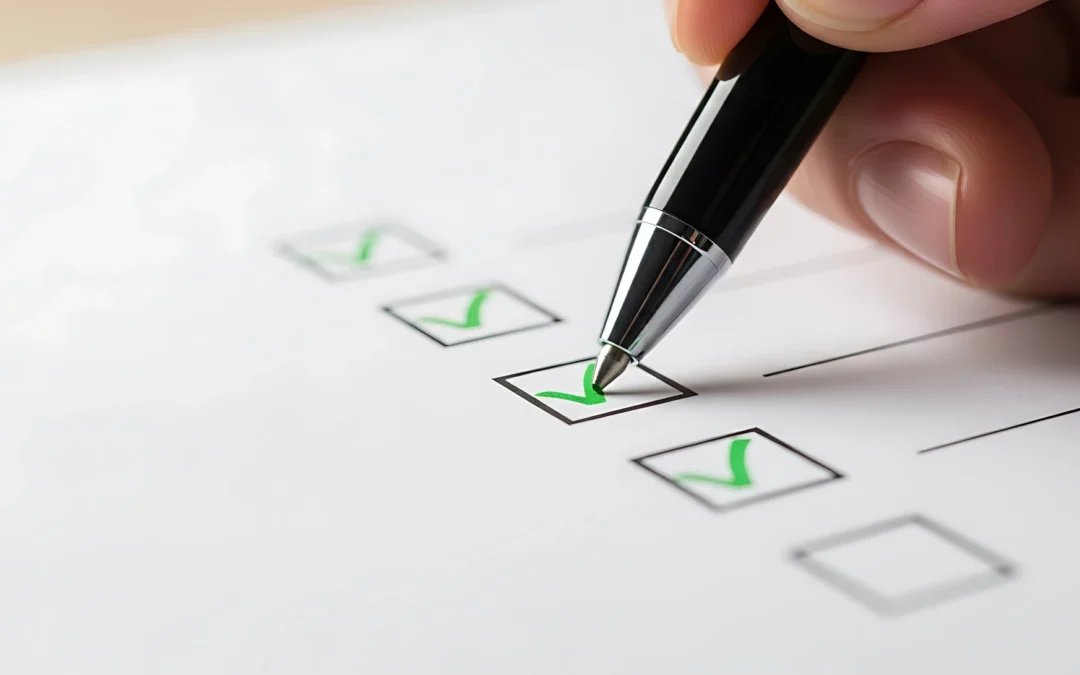 A close-up of a hand holding a pen and checking boxes on a paper questionnaire